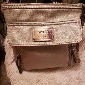 White crossover bag by (Calvin Klein)